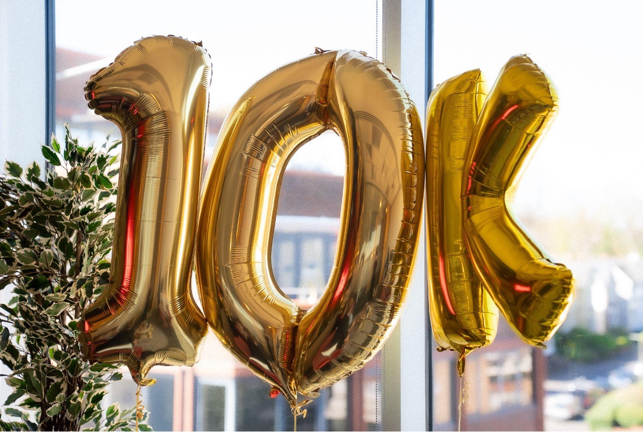 Gold 10K balloons representing a £10,000 prize at Chaotic HQ 
