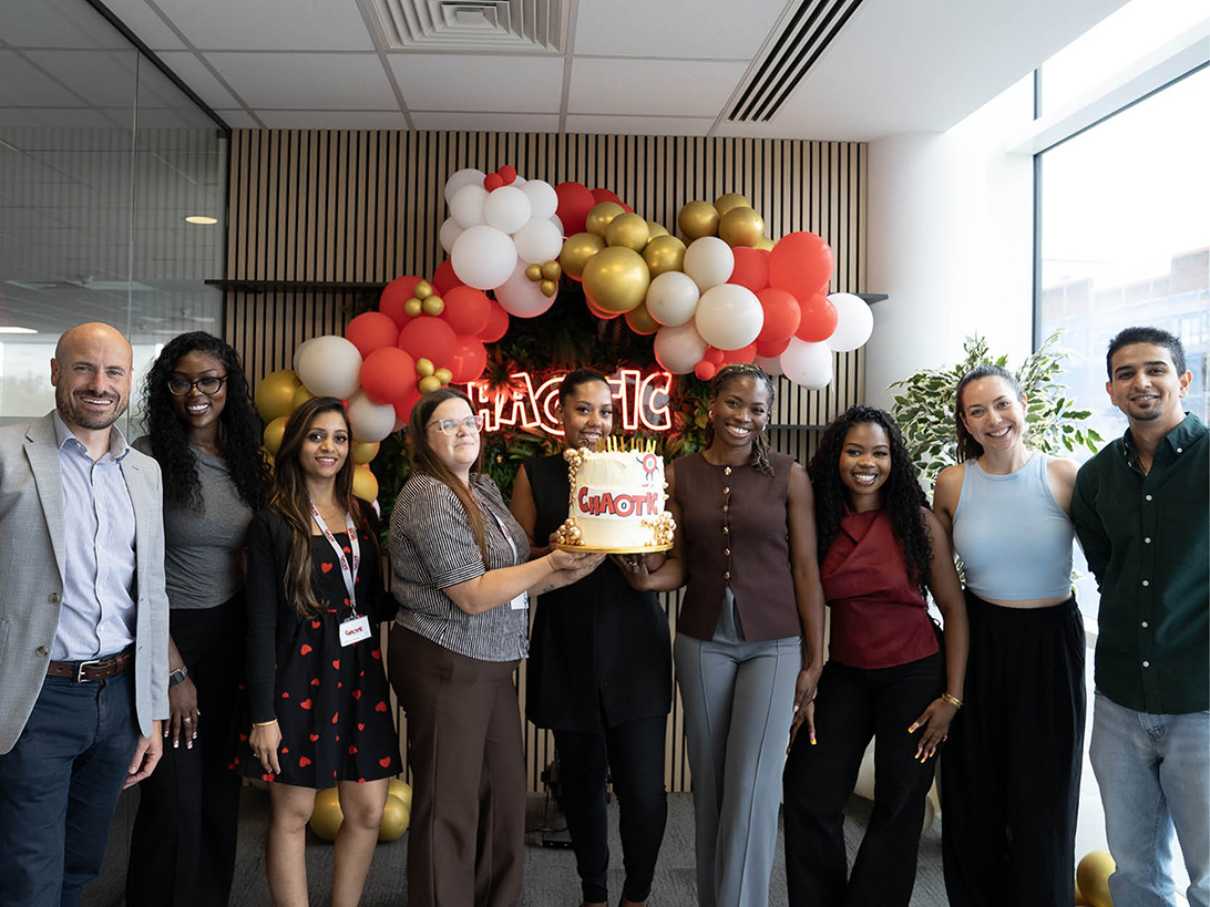 Team holding 2million cake