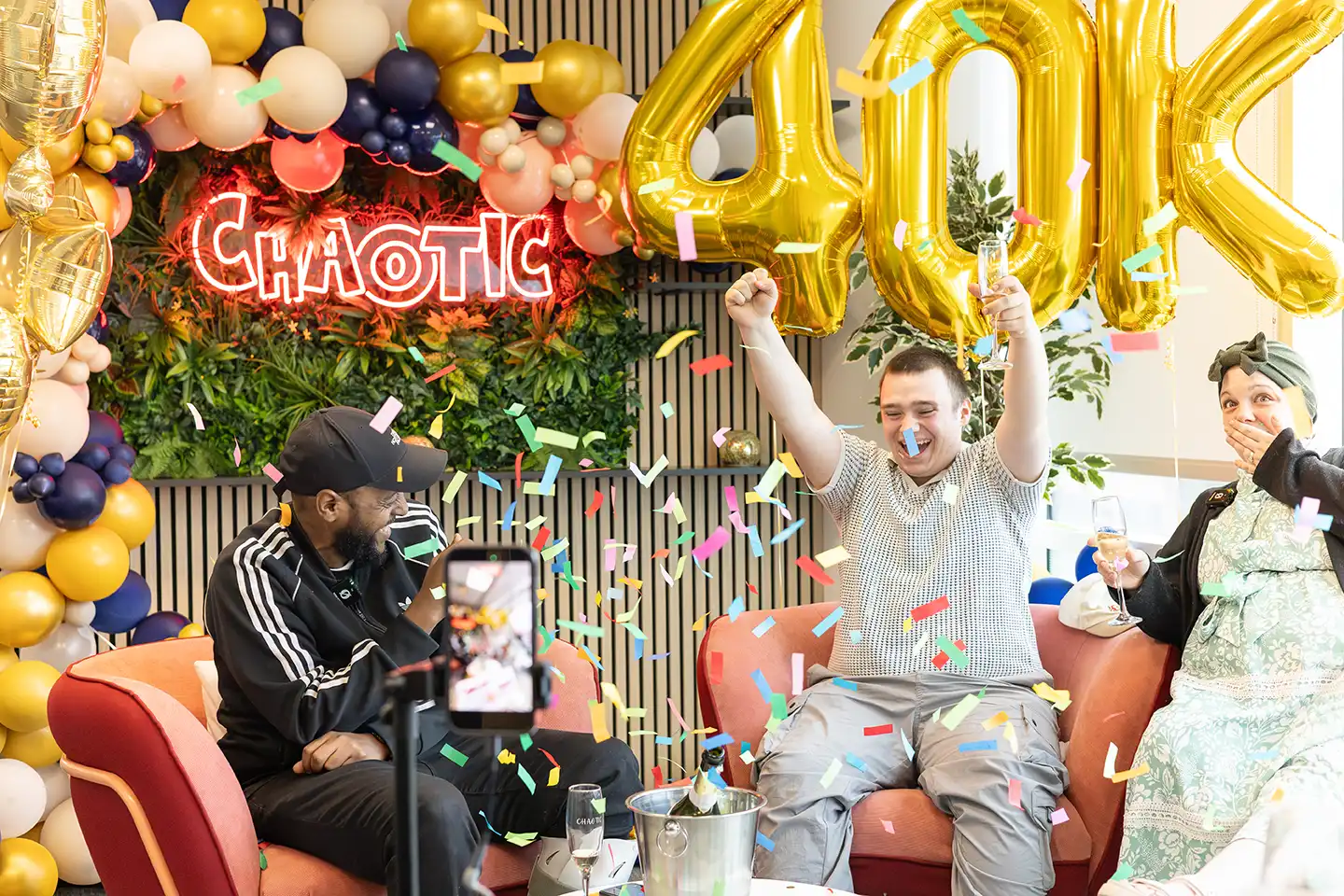 Khalid and his friend celebrating the 40k win